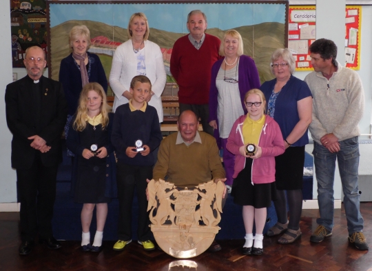 The beautifully carved plaque by John Evans was presented to Fochriw School on the 21st May 2013.  Carved with drawings from 3 of the children who attend Fochriw School, showing part of Fochriw's history.